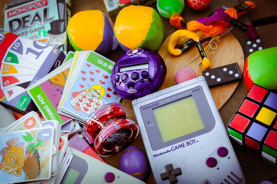 Minneapolis, USA - Sept 16, 2025: Looking down at a collection of retro games, cards, and puzzle items from different brands and decades. For Editorial Use Only.