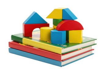 Isolated colorful building blocks on top of stacked books for educational purposes