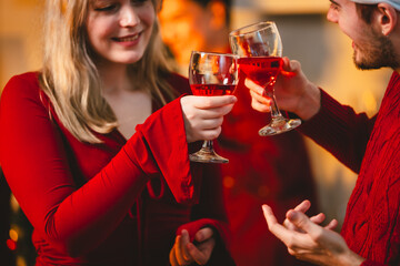 A cheerful group of diverse friends gathers around a decorated Christmas tree, exchanging gifts with laughter and joy at a festive holiday party.