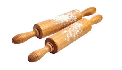Two wooden rolling pins with flour