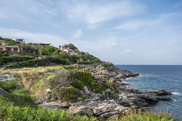 Village beach view Roadtrip Winding road along rocky coast of Cap Corse peninsula on Corsica island France