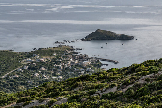 Village beach view Roadtrip Winding road along rocky coast of Cap Corse peninsula on Corsica island France