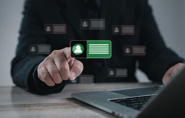 Corporate professional selecting candidate profile on laptop with virtual digital interface. Concept of recruitment, job application, human resources management, and modern career technology.