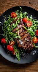 Grilled steak with arugula and cherry tomatoes on a dark plate
