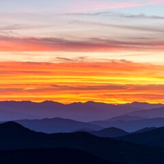 Obraz premium Sunrise over mountain range