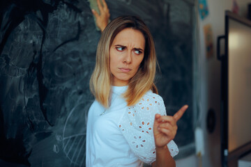 Angry Teacher Erases Blackboard Pointing Finger Students. Upset professor not tolerating...