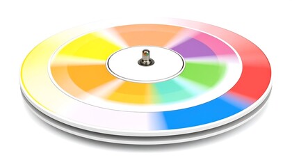 A color wheel spins, its hues blending in a circular motion. A metallic central spindle adds a dynamic touch. White background