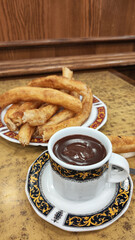 Traditional breakfast of churros with hot chocolate