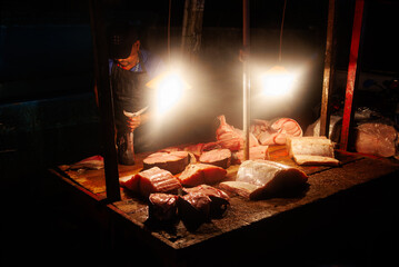 Fish market, man cutting tuna fish