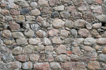Old irregular stone wall background
