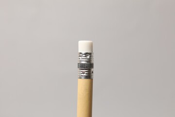 Obraz premium One graphite pencil on grey background, closeup