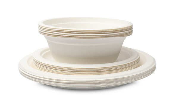 Disposable tableware. Stack of paper bowls and plates isolated on white