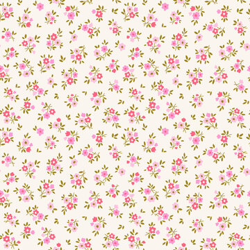 Vector seamless pattern. Cute pattern in small daisy flowers. Small red and pink flowers. Beige cream background. Ditsy floral background. Hand drawn template for fashion textile prints. Stock pattern