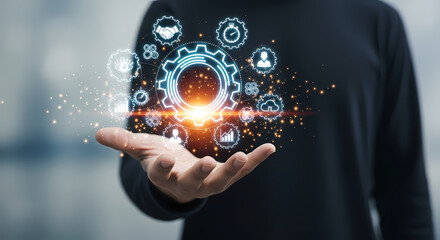 Businessman holding a holographic gear interface, symbolizing business process automation, innovation, and operational efficiency.