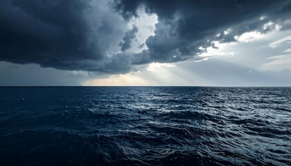Dark sea surface with a dramatic cloudy sky above, approaching storm