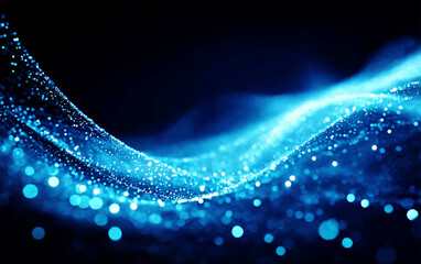 Abstract blue light waves with sparkling particles in dark background