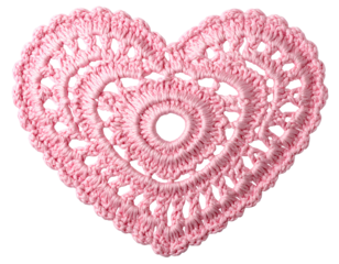 Pink crocheted heart shape with intricate pattern handmade isolated on a transparent background.