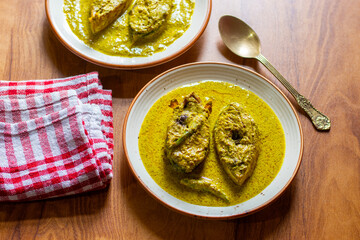 Traditional Bengali Hilsa Curry with Mustard Seeds, Aromatic Spices, Rich Flavors, Authentic Taste,...