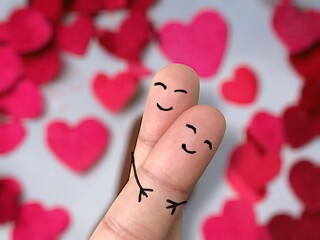 Create idea concept of finger show Emotion in happy love Of lover in gesture hug together on bokeh background, Finger people in love. Lucky in love concept, finger people hugging on crossed fingers