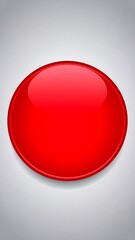 A glossy, vibrant red circle stands out against a muted gray background, creating a striking visual contrast.