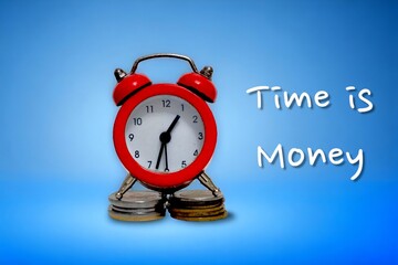 Close-up view of a stack of coins and clock hands . Concept of the idea of time is Money