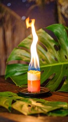 Flaming cocktail on a wooden table