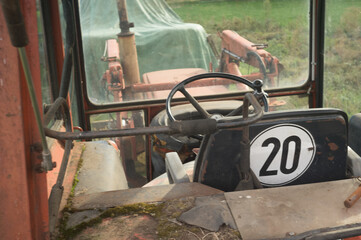 Old tractor cabin interior showing steering wheel