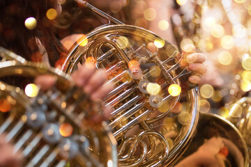French horn instrument, hands playing horn player in philharmonic orchestra