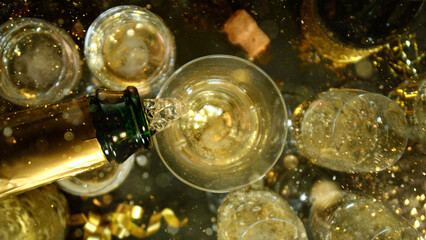 Freeze motion of pouring champagne into flute. Concept of celebration and success.