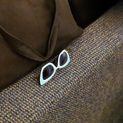 Stylish Sunglasses on Textured Seat