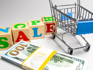 A shopping cart with a sign that says Sale.