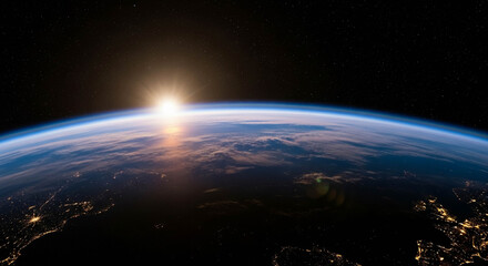 Fototapeta premium Earth from Space with Sunrise Over Horizon, City Lights, and Atmospheric Glow