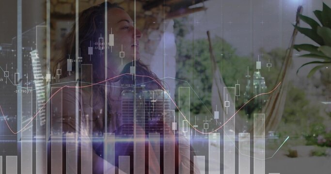 Woman sitting in hammock chair on patio, with financial chart overlay, copy space - Powered by Adobe