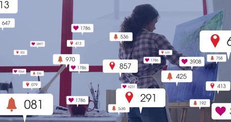 Naklejka premium Mature artist in plaid shirt painting on canvas at art studio with notification icons, copy space