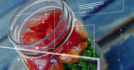 Showing glass jar holding multicolored candy pieces on blue tabletop with digital HUD overlays