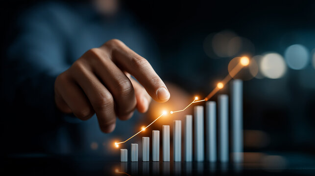 Sales manager hands touching growth arrow and bar chart hologram on virtual screen demonstrating digital transformation and financial progress on dark background. sales increase