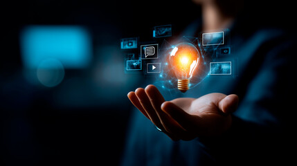 AI innovation specialist hands showing glowing lightbulb icon hologram surrounded by multimedia icons for video audio image chat on dark background. AI innovation multimedia