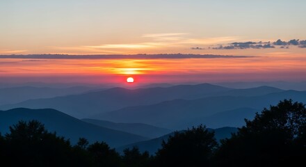 Obraz premium Majestic Sunset Over Layered Mountain Ranges at Dusk