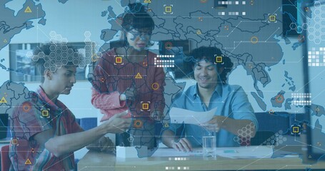 Collaborating tech professionals examining prototype, reviewing docs in office with overlay