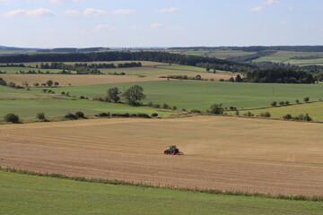 Tractor in a field in summer