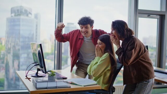 Team members excited achievement in office coworking space. Happy winners rejoicing