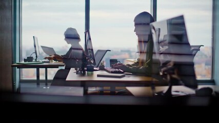 Busy corporate office silhouettes at cityscape window closeup. People working - Powered by Adobe