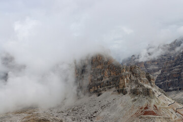 Rain clouds blanket the peaks and valleys of the Dolomites