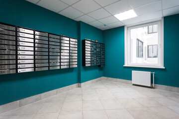 mailboxes in the lobby of an apartment building