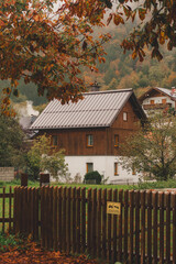 Autumn landscape of a cottage in a charming alpine village
