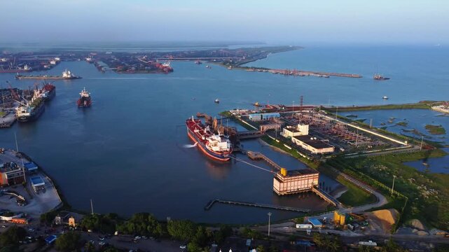 Aerial view of a indian sea port with crude oil tanker ship. Paradip Port with Cargo Ships and Industrial Infrastructure, Paradip, Odisha, India