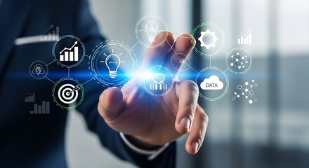 A person touching a screen with various digital icons representing data and business concepts displayed