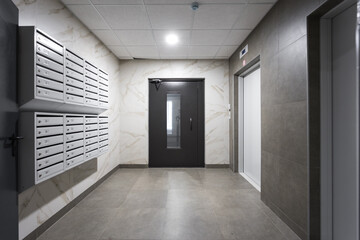 mailboxes in the lobby of an apartment building