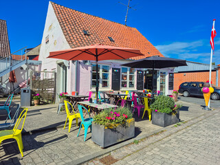 04.09.2025. Aero.Denmark.A Charming Outdoor Cafe featuring Vibrant Colorful Furniture and Trendy Modern Decor