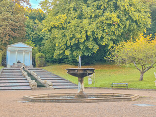 03.09.2025. Schleswig.Germany.A Serene Fountain Found in a Beautiful Tranquil Park Setting Among Natures Splendor